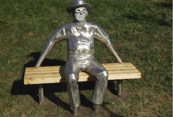 Man Sitting on a Bench by Keith Raivo