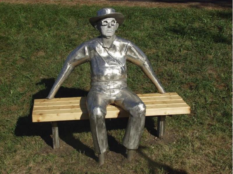 Man Sitting on a Bench by Keith Raivo